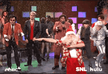 SNL cast members dancing in a Christmas sketch
