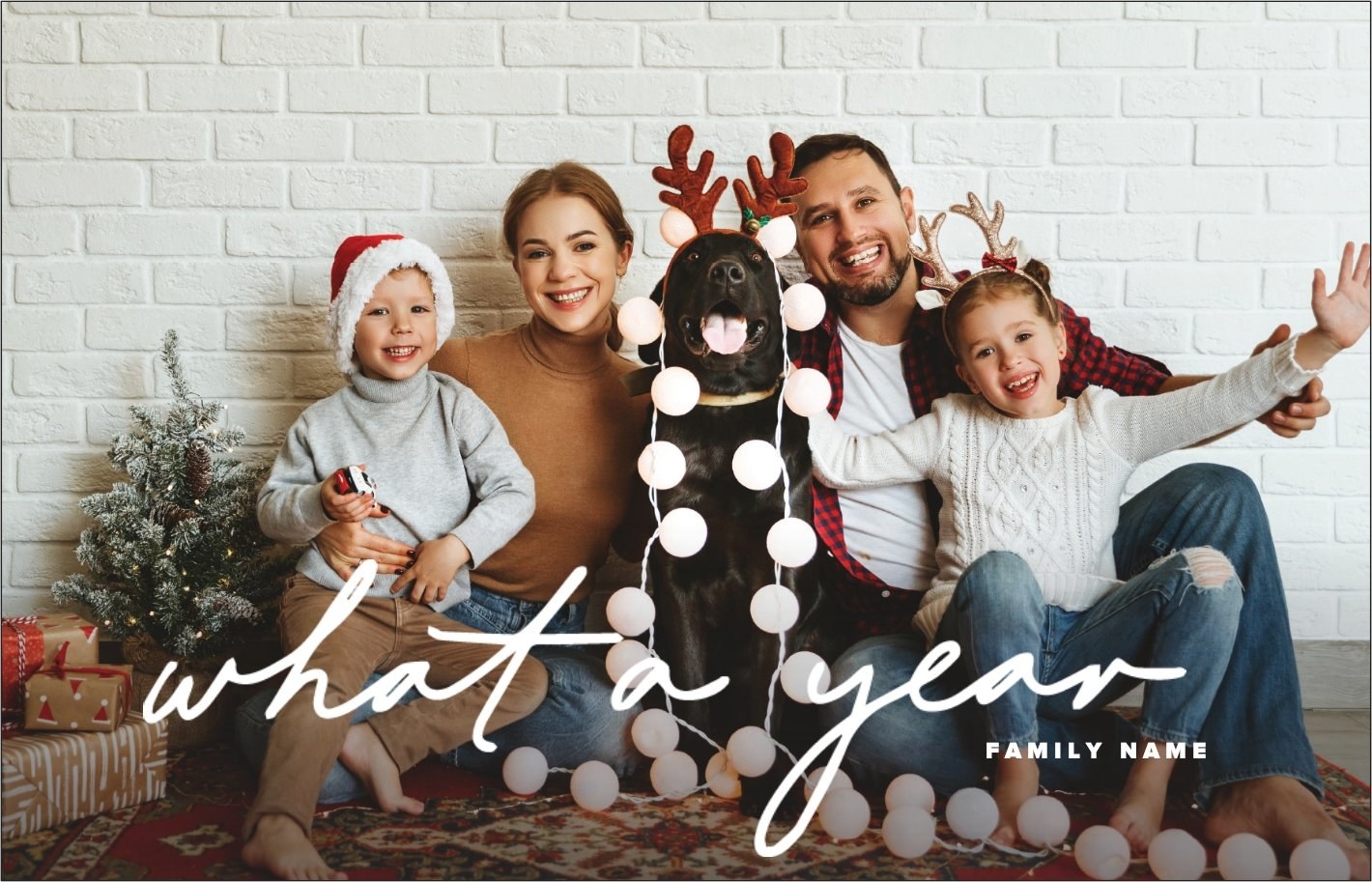 The horizontal family holiday card with script text that reads &quot;what a year&quot;