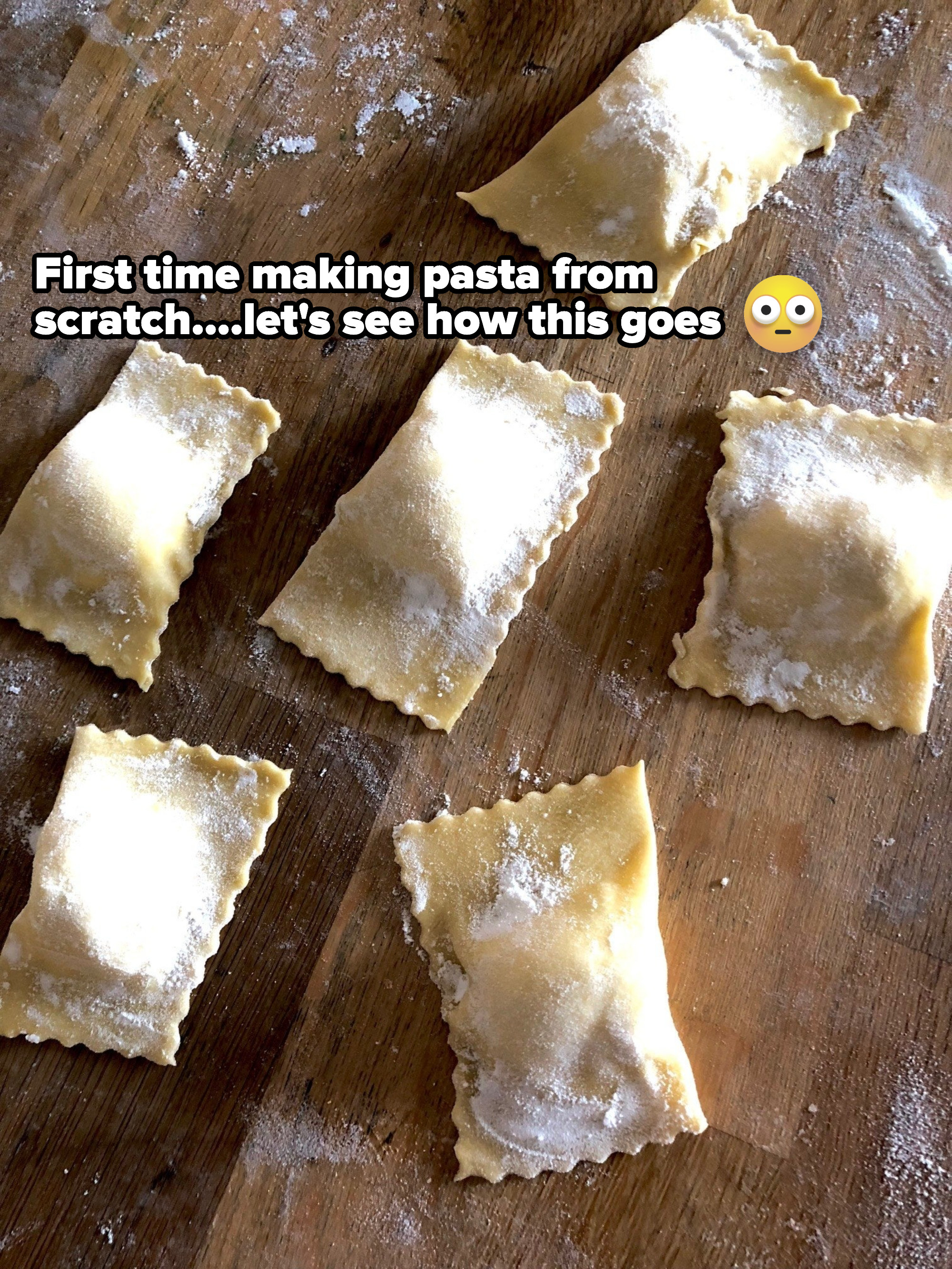 Homemade raviolis on a floured surface