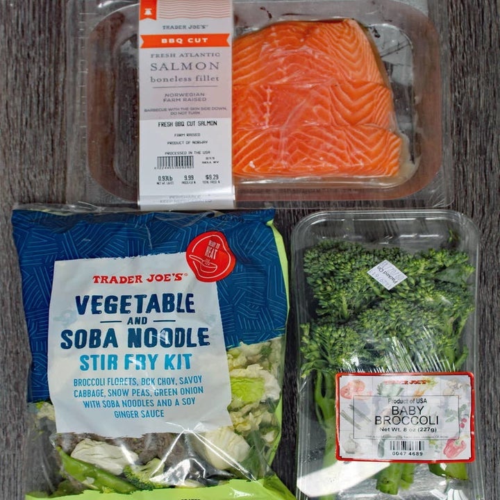 Salmon, a salad kit, and baby broccoli.
