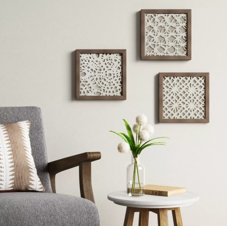 An image of a set of three framed artwork made from woven rice paper
