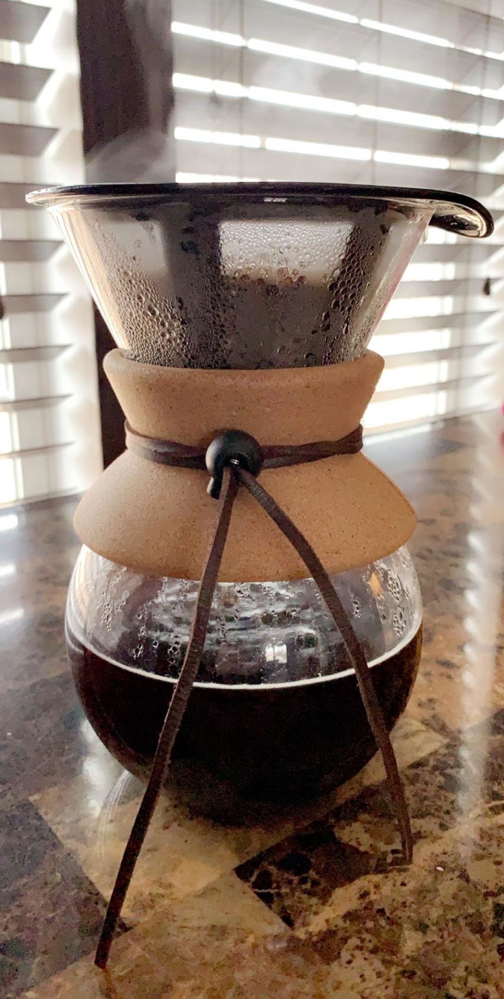 Reviewer photo of their pour over coffee maker filled with hot coffee