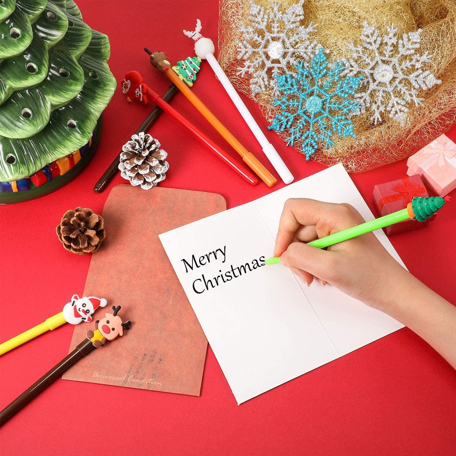 pens with toppers shaped like christmas trees, santas, and reindeer