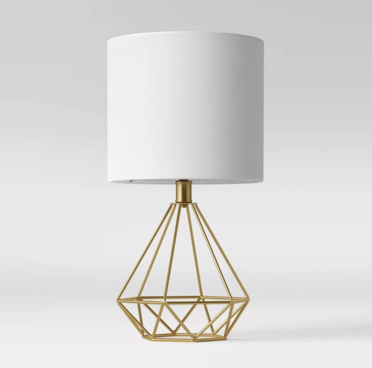 An image of a wire geo table lamp with a brass finish