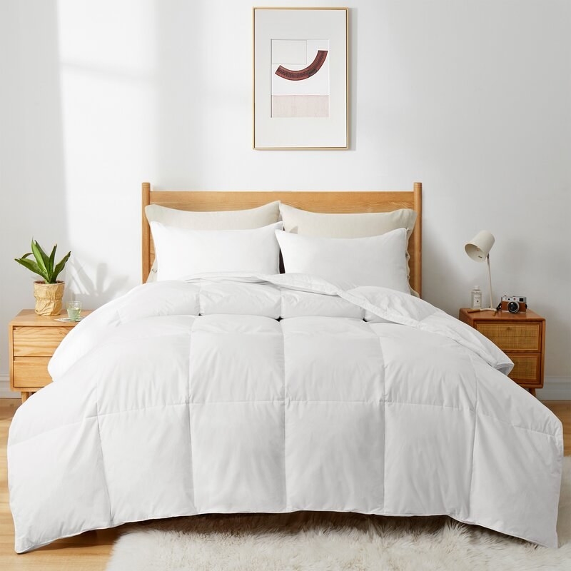 The white quilted comforter on a bed