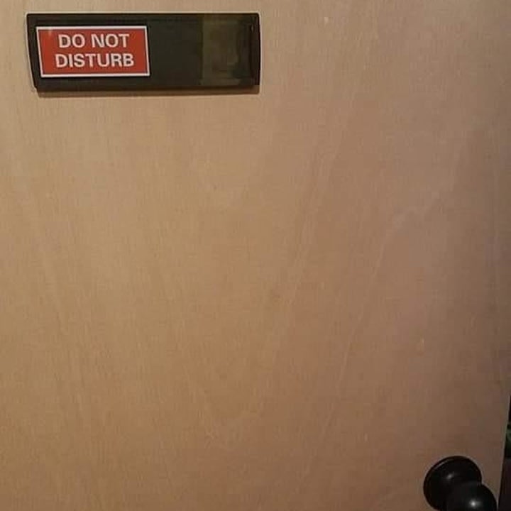 review photo that shows the sign on a door