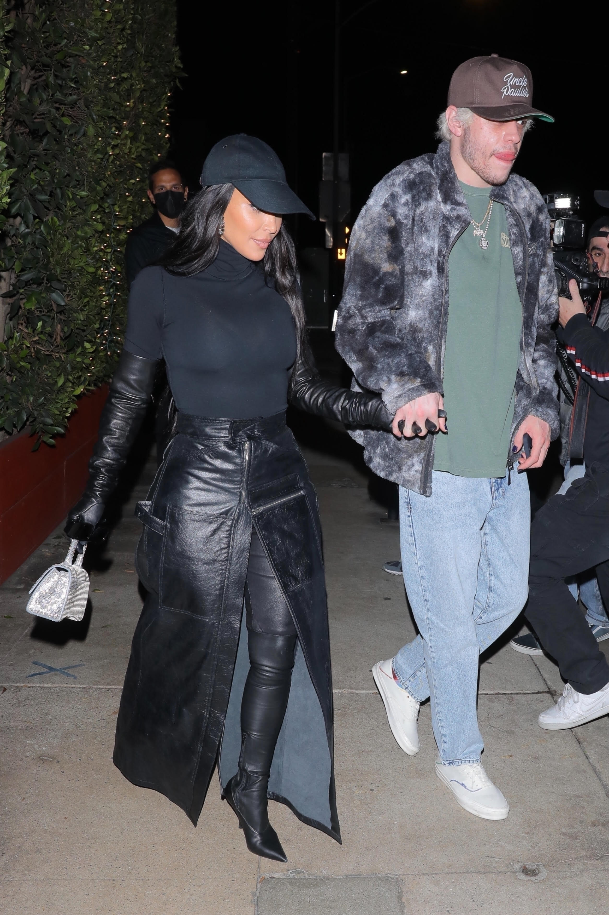 Kim Kardashian and Pete Davidson exiting a restaurant hand-in-hand