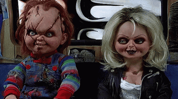 Chucky and Tiffany look at each other