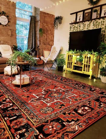 reviewer's colorful living room with the rug on the floor