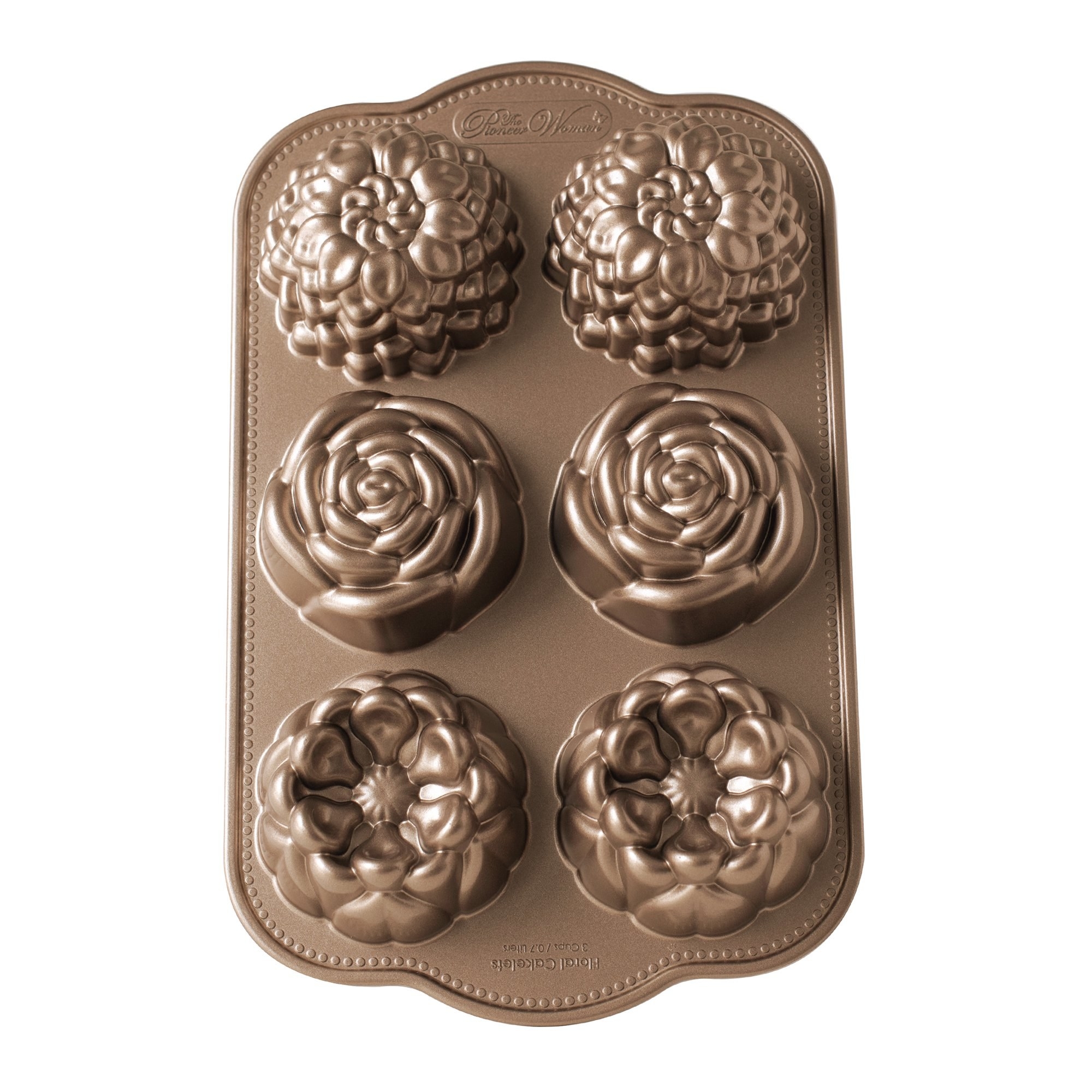 A bronze cake pan with six floral molds