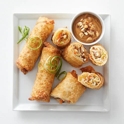 vegetable egg rolls served on a plate with dipping sauce