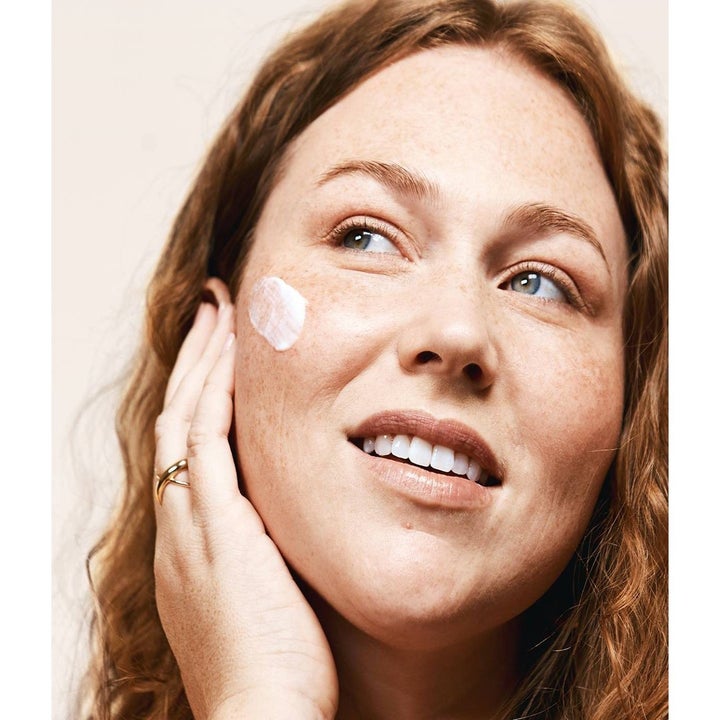 Model using the Hero Cosmetics Collective prebiotic moisturizer