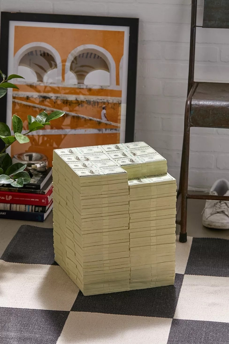 stool in the shape of realistic hundred dollar bills in a giant stack
