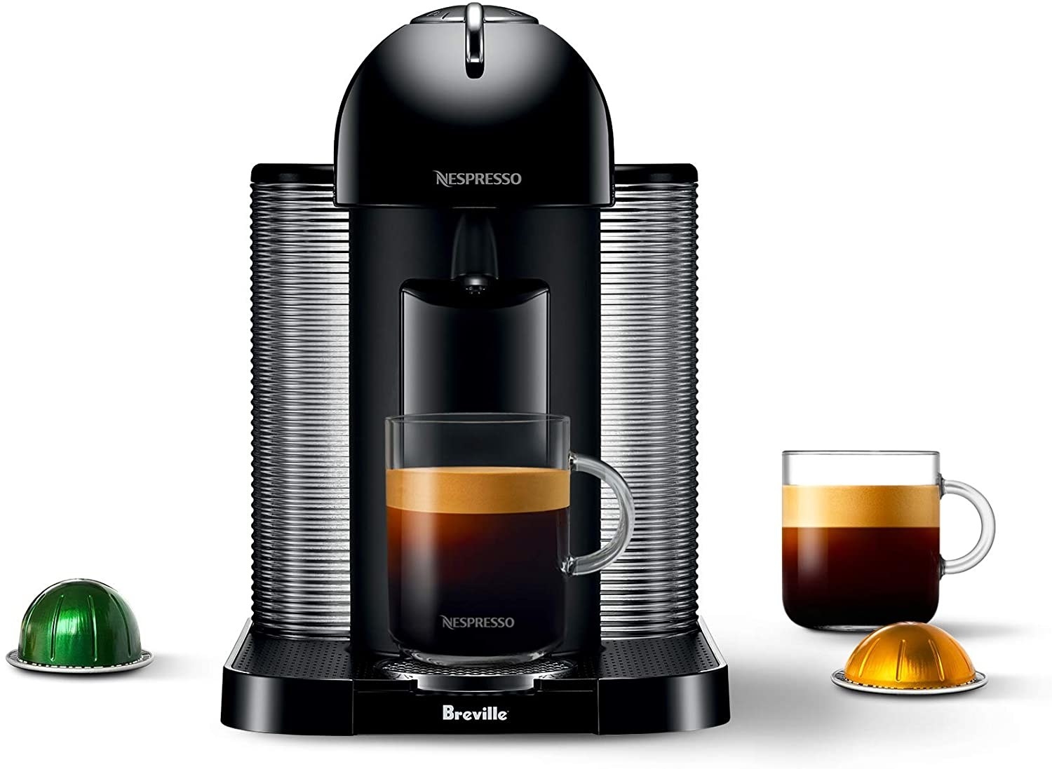 The Nespresso machine on a blank background with a cup off coffee on its platform