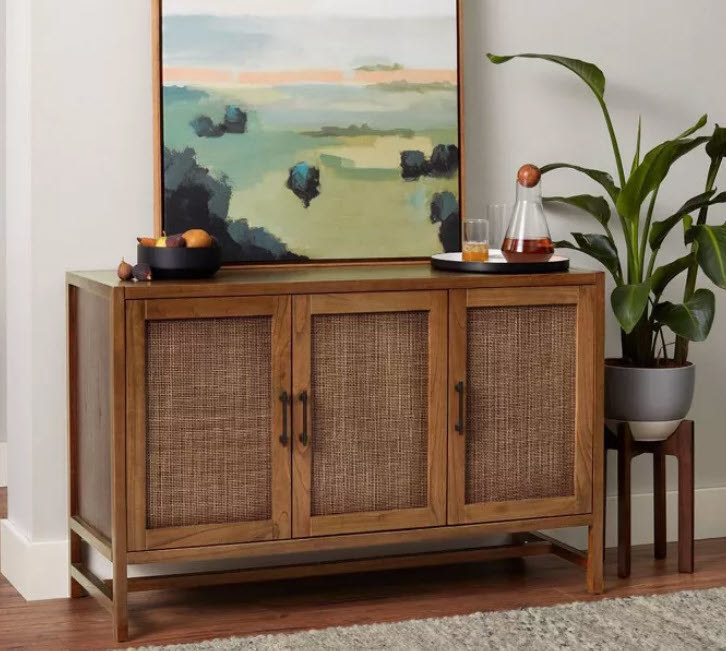 A medium-brown wooden TV stand with mesh-screen door frames and black handles. Standing on 4 wooden legs and can carry up to 59&#x27; TV.
