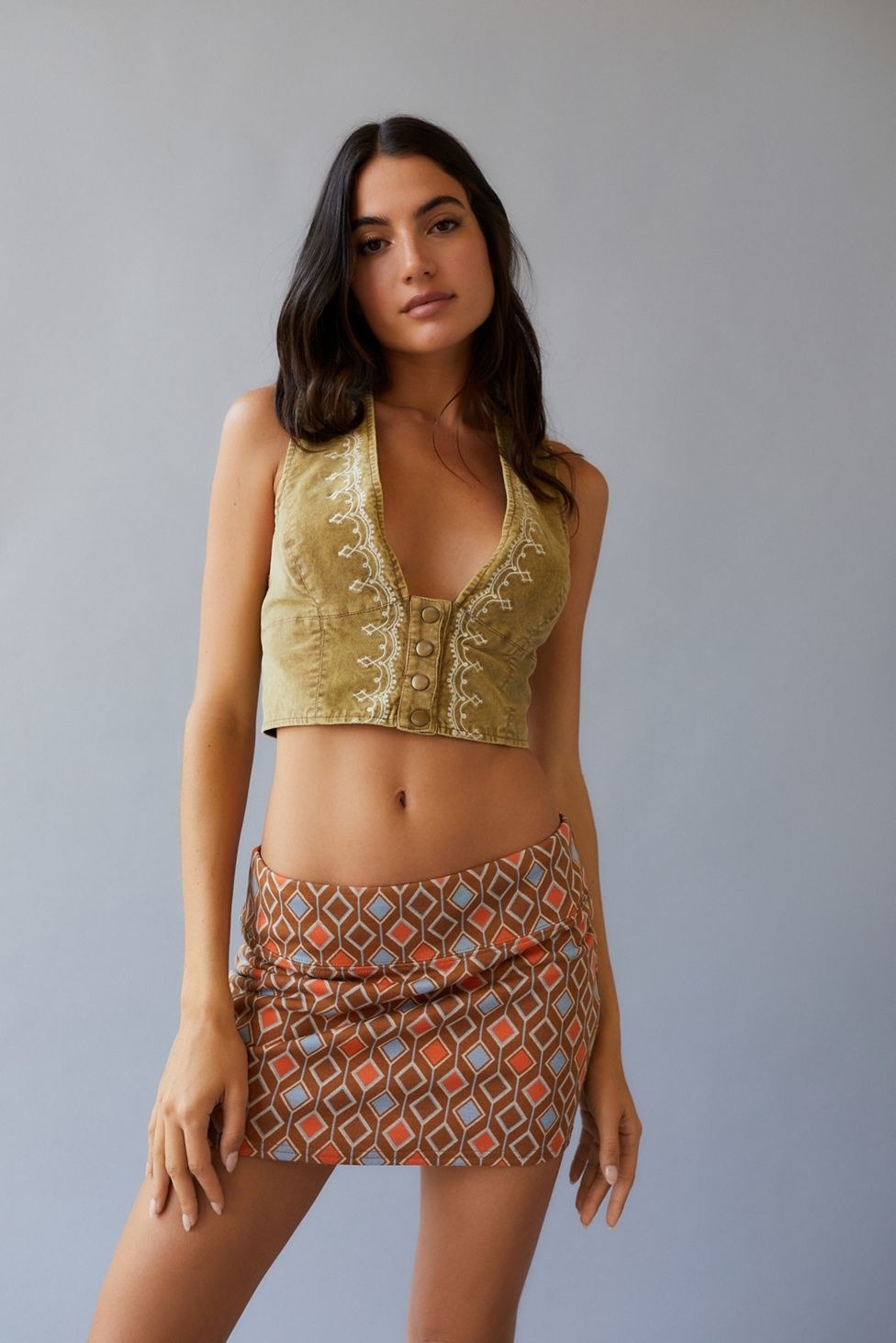 model in brown vintage pattern low-waist mini skirt