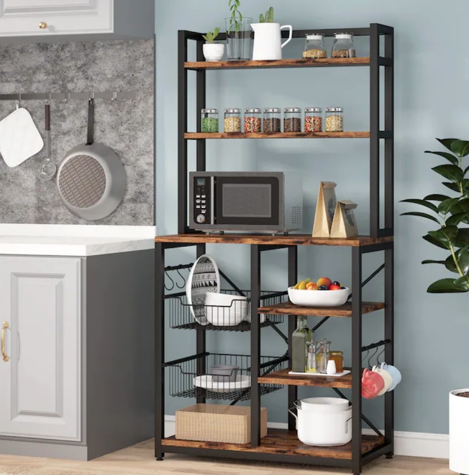A 6-tier black metal/wood baker&#x27;s rack with two pull out wire baskets and six hanging hooks