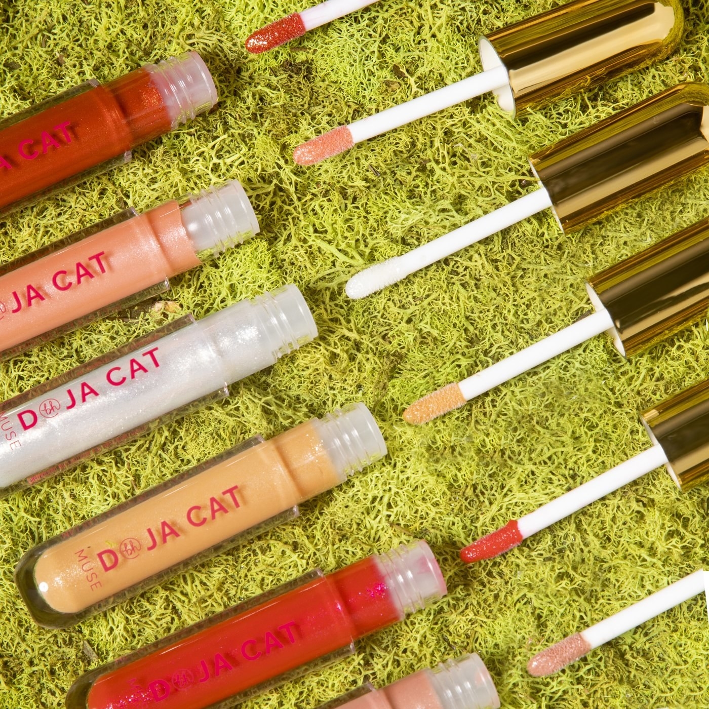 a bunch of plumping lip glosses in different colors