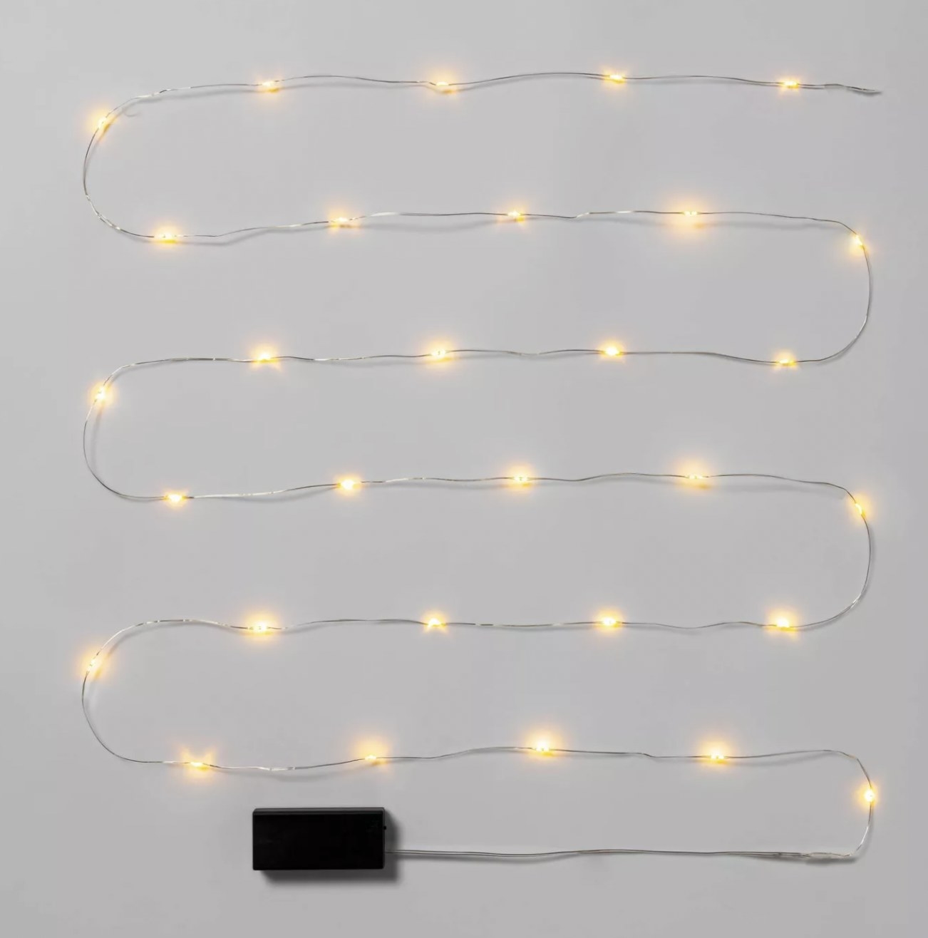 The string of warm white lights on silver wire