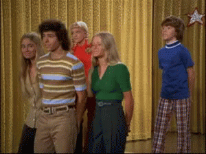 Brady Bunch siblings swaying on stage