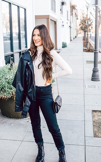 reviewer wearing the cream bodysuit