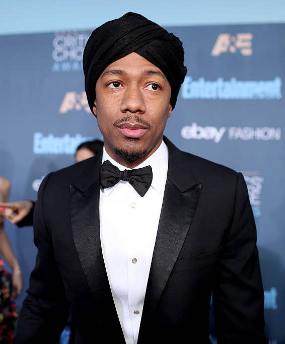Nick in a tux and matching turban at a red carpet event