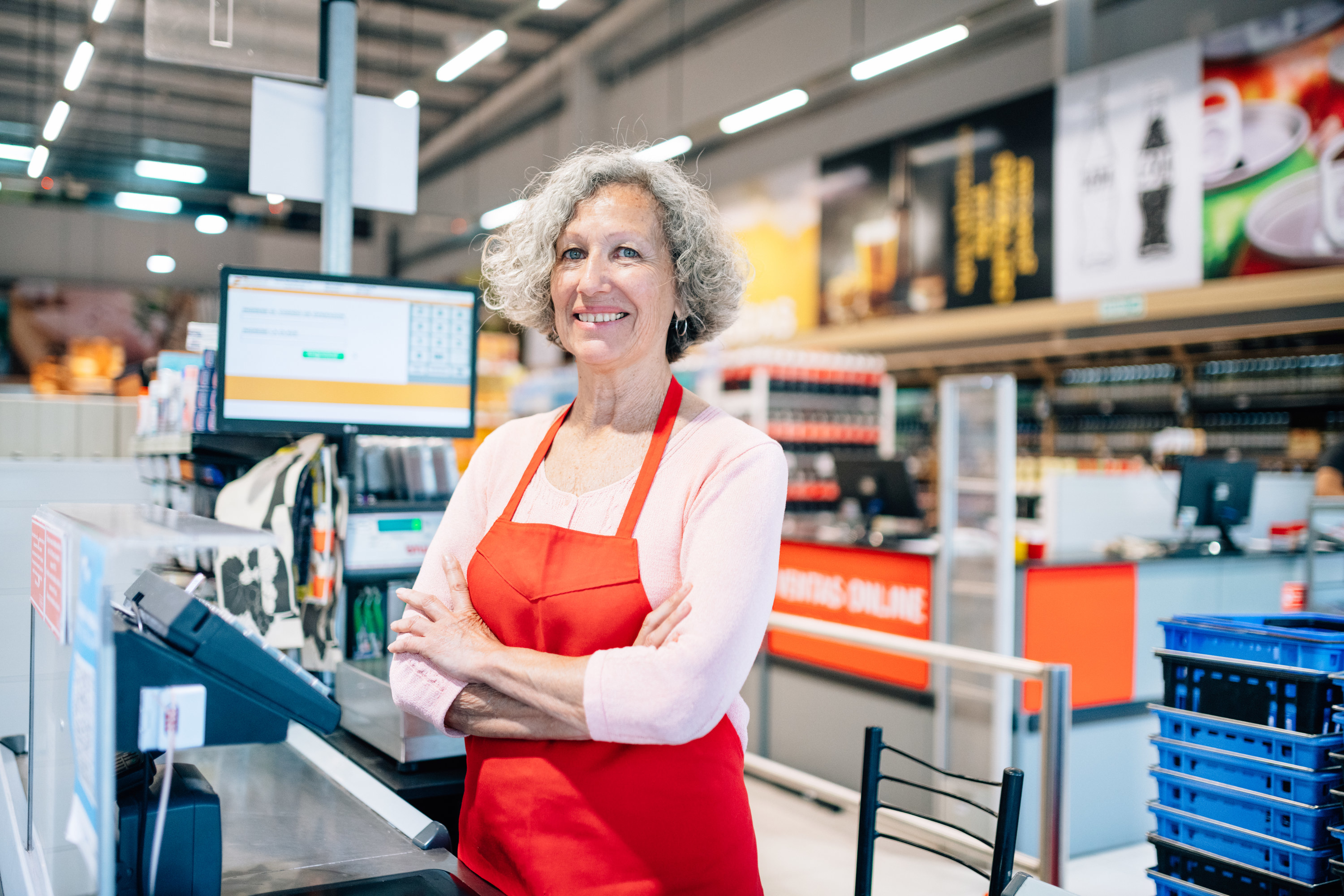 Senior woman working as a cashier