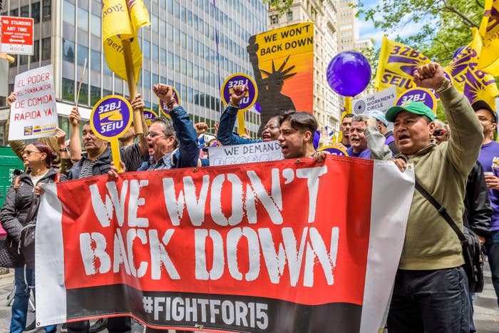 Workers marching for a $15 an hour minimum wage