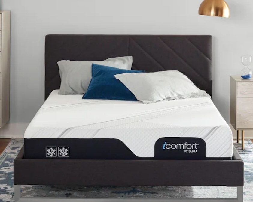 A memory foam mattress in a bed frame