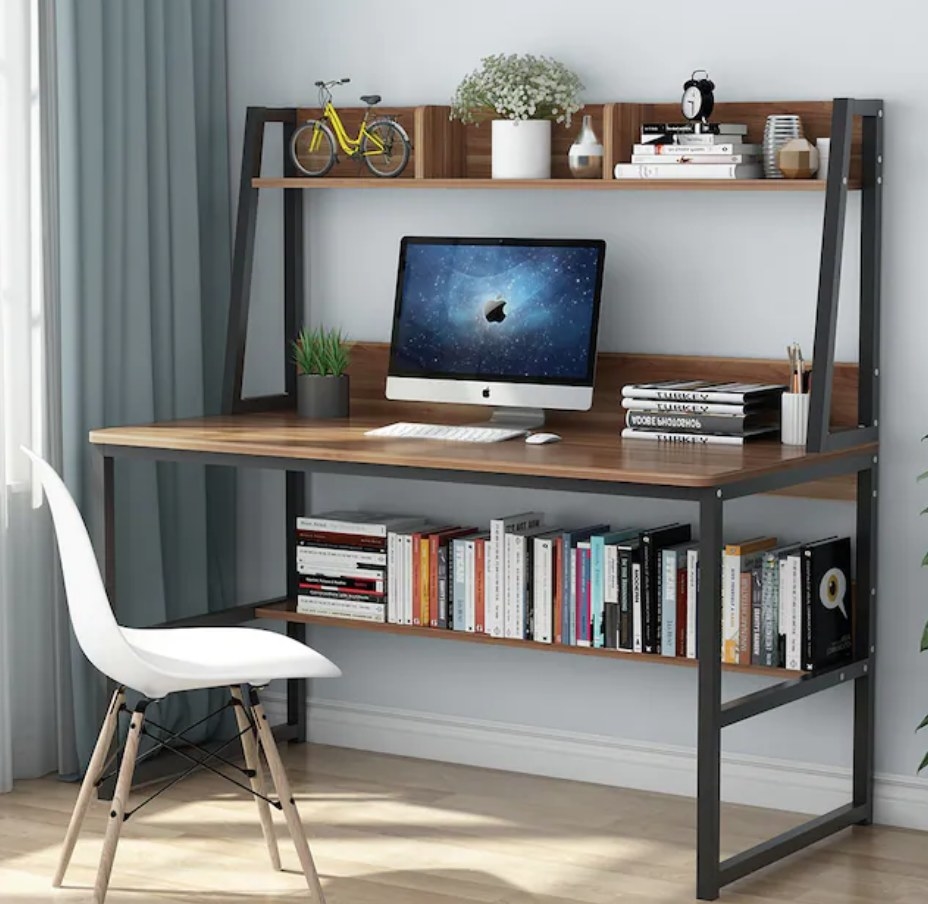 A brown wooden computer desk with 3 shelves above and one shelf below