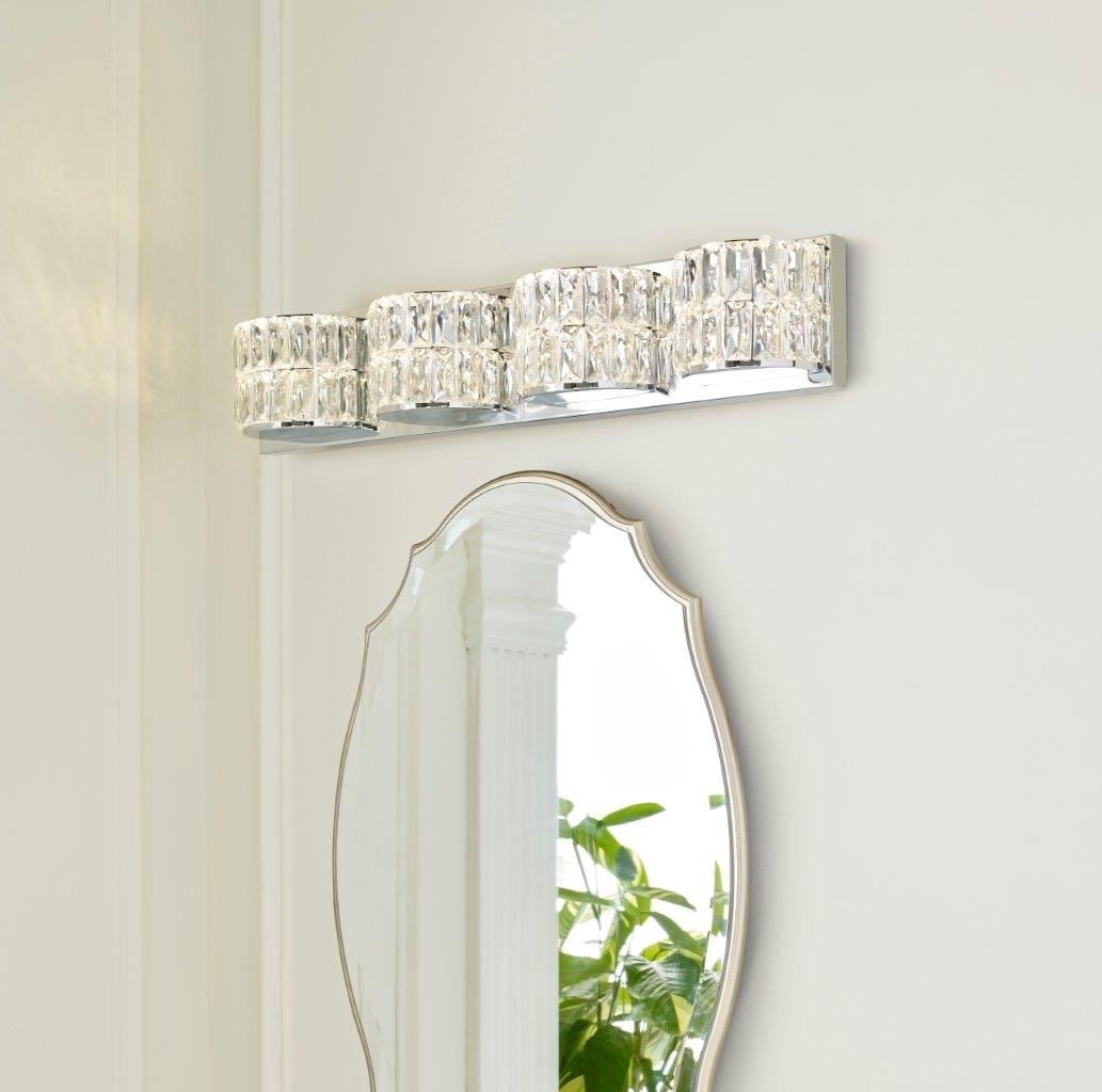 crystal and silver vanity light above a mirror