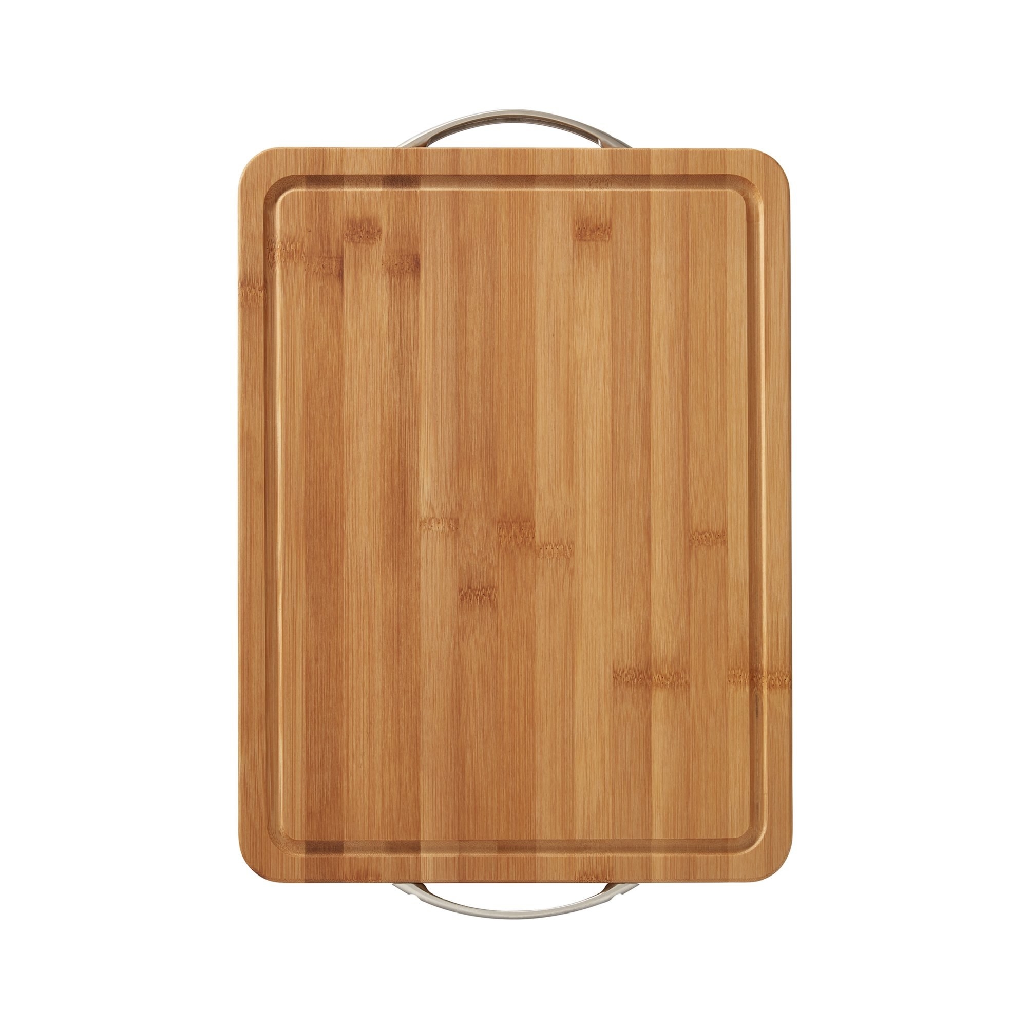 Overhead shot of a bamboo cutting board with metal handles and a grooved trench just inside its border