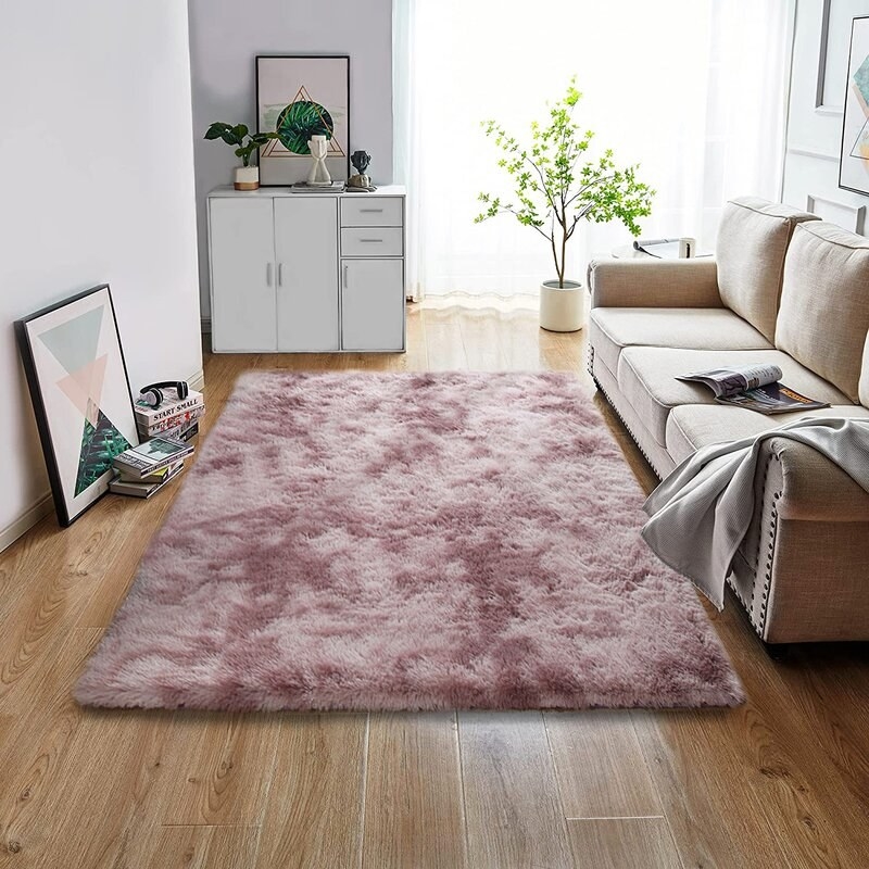 the blush pink rug in a living room
