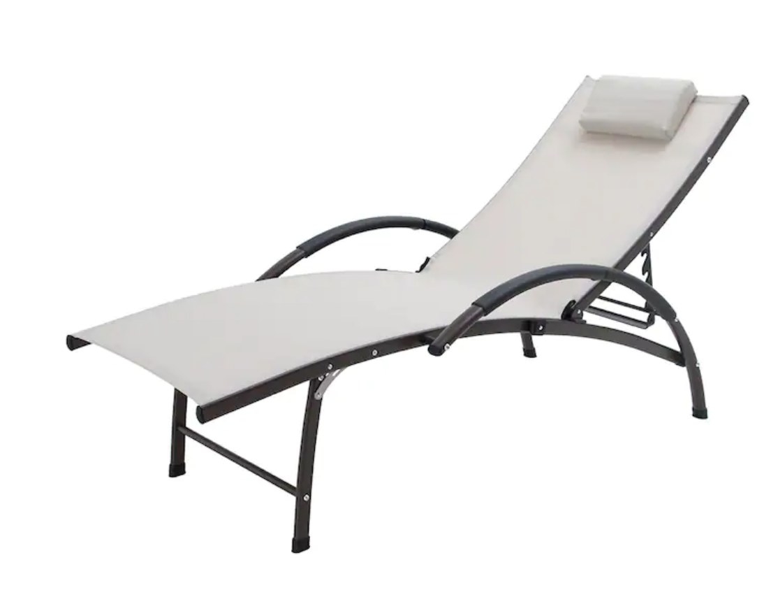 An adjustable white chaise lounge with a black metal base and attached pillow