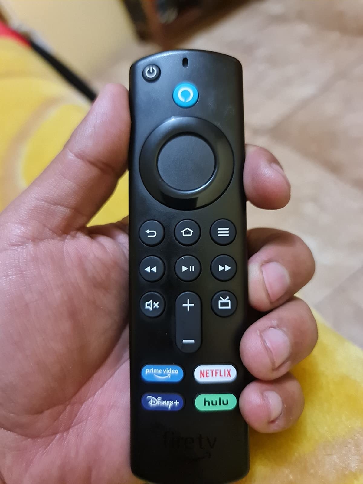 Reviewer holding the Fire Stick