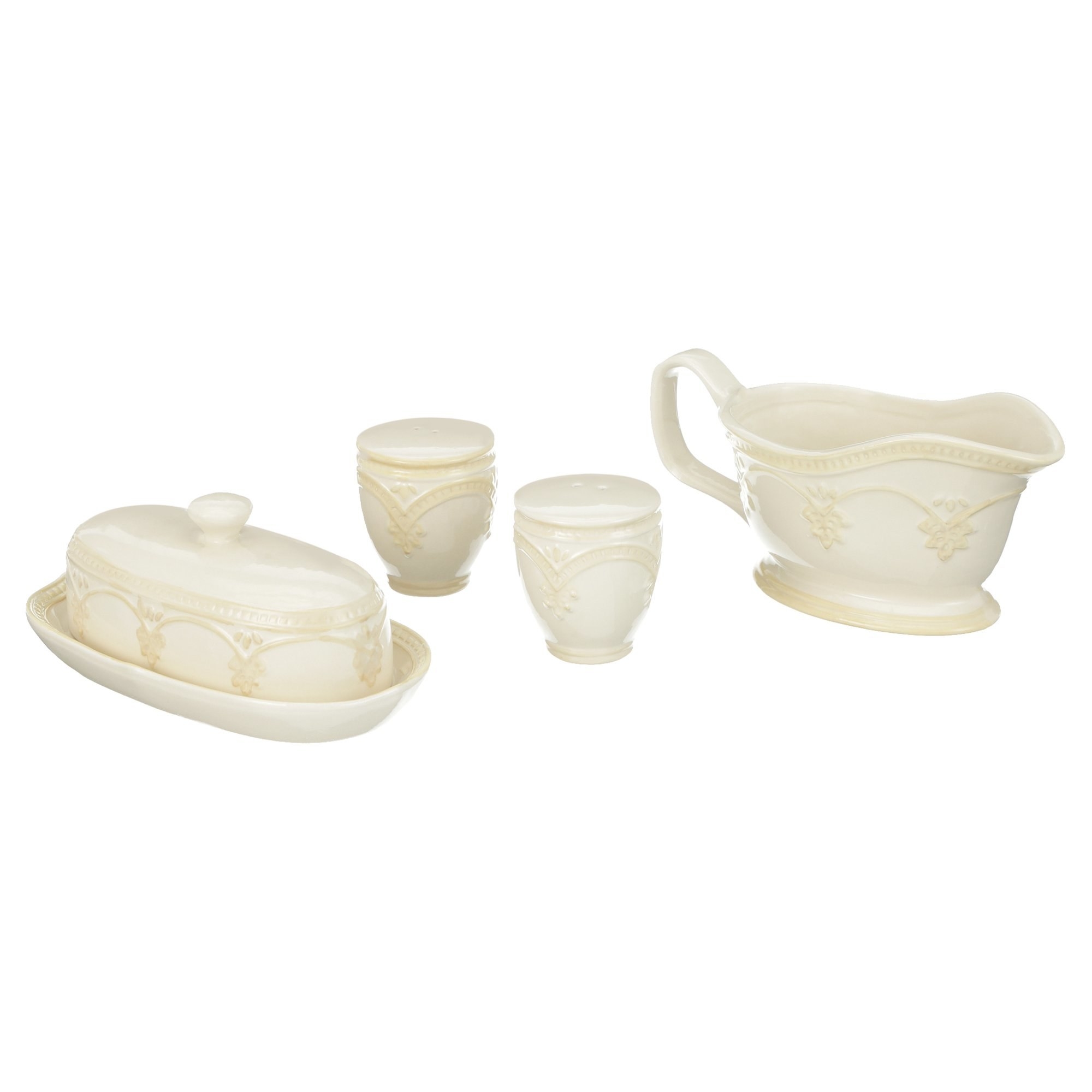 A butter dish, gravy boat, and salt and pepper shakers with elegant embossed details