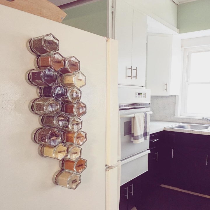 a reviewer shows their fridge with 24 small jars