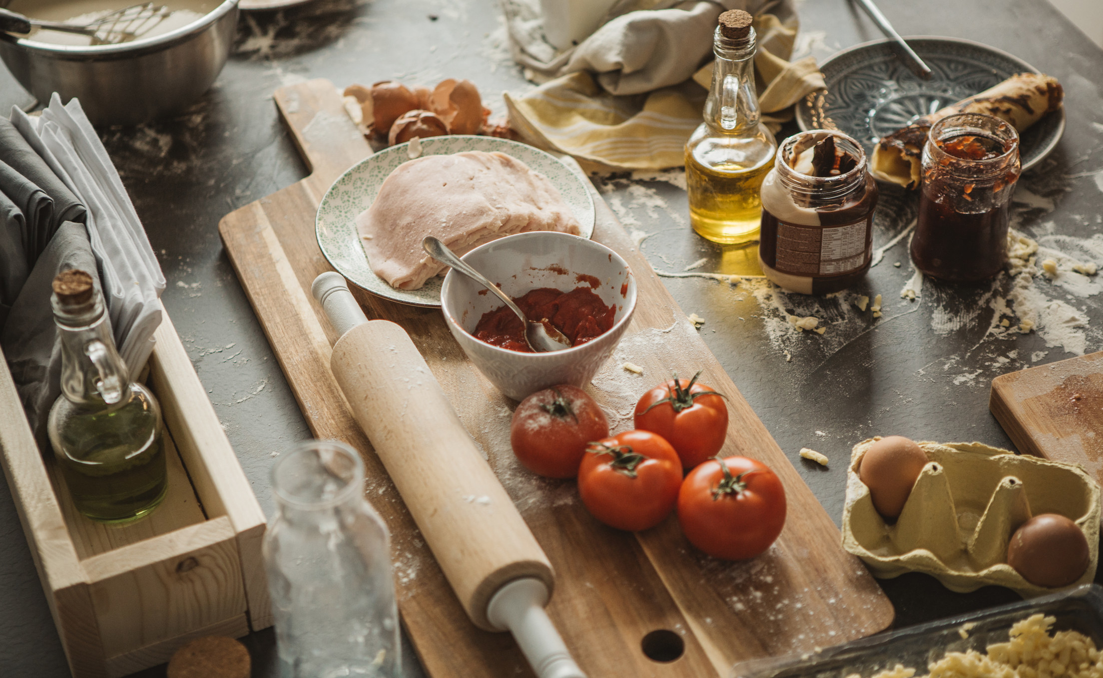 A messy kitchen with lots of ingredients.