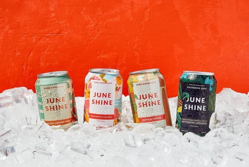 The four cans of included hard kombucha