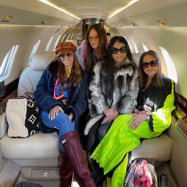 4 women sitting in a private jet