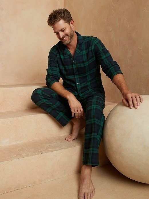 model wearing blue and green plaid pajamas