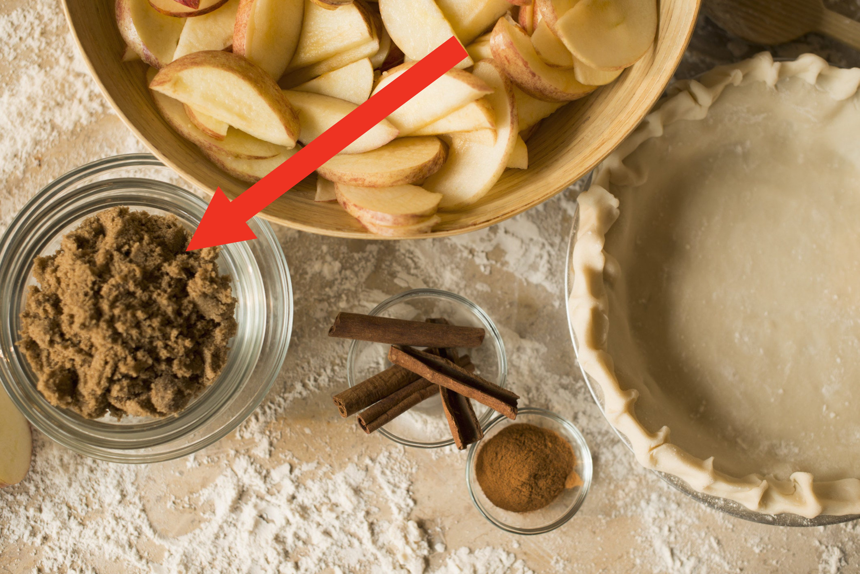 Close up of apples, spices and empty pie shell