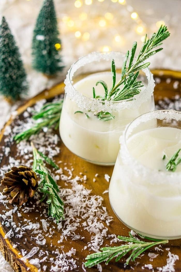 white margaritas with fresh rosemary and coconut rim