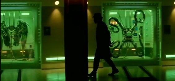 The Gentleman walking down a hall with Doctor Octopus&#x27;s tentacles and Vulture&#x27;s wings on display in &quot;The Amazing Spider-Man 2&quot;