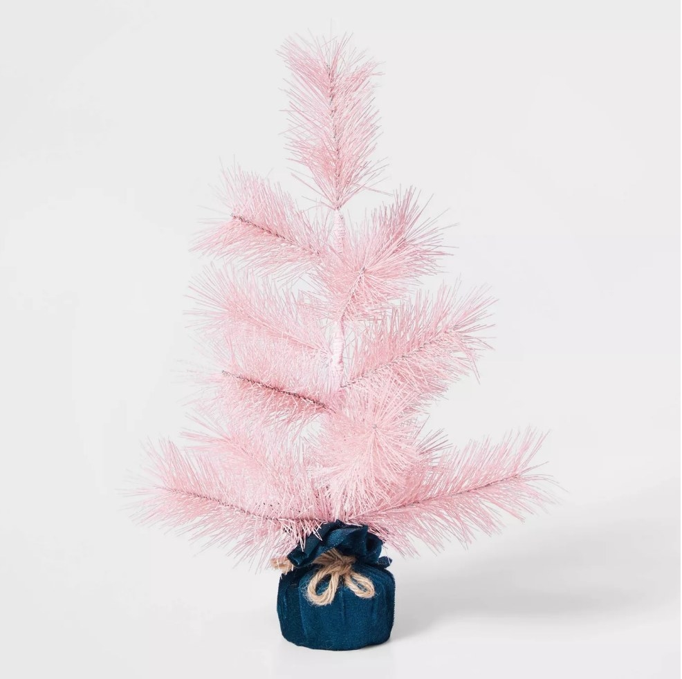Pink artificial tree with blue velvet wrapped base