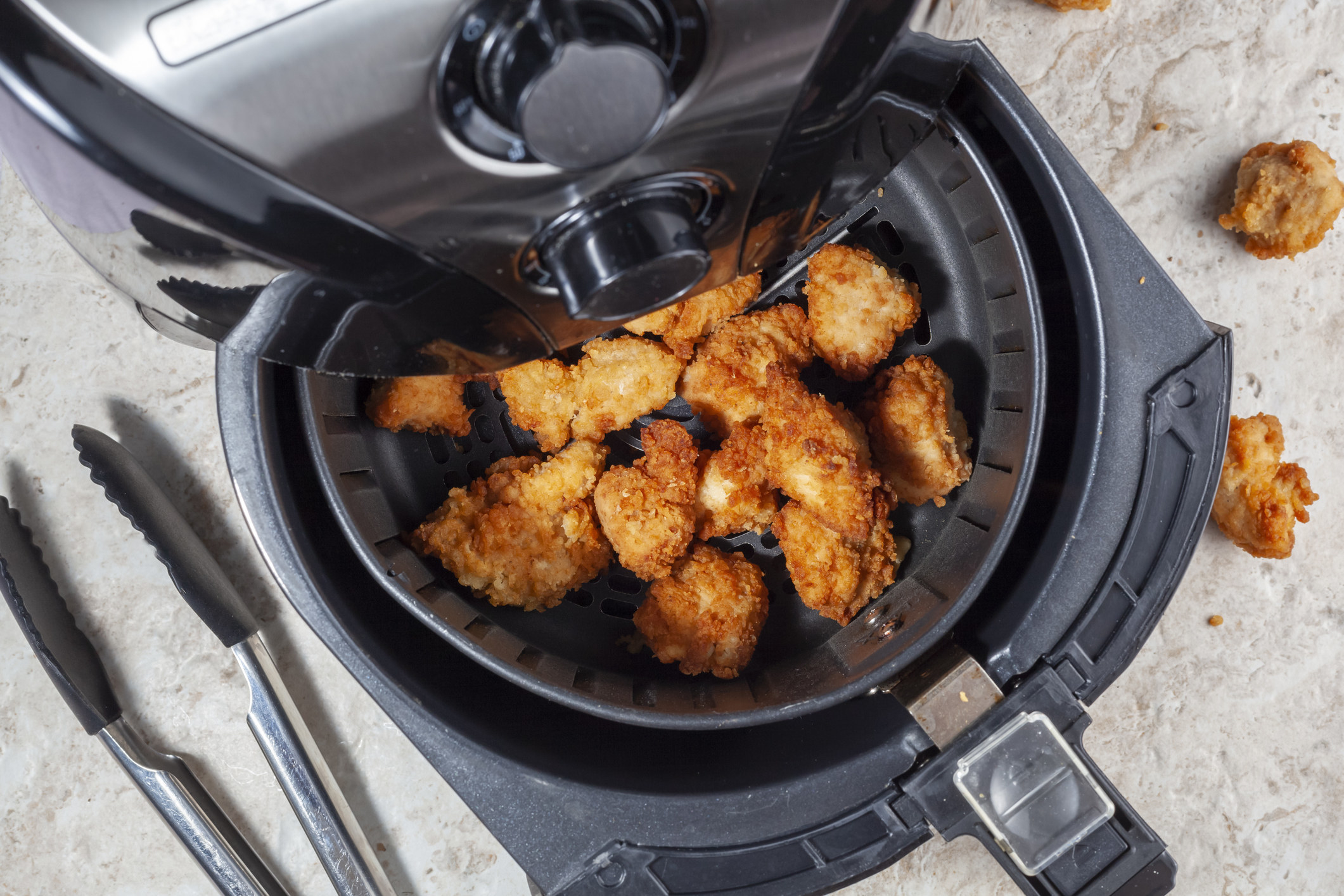 Chicken nuggets in an air fryer.