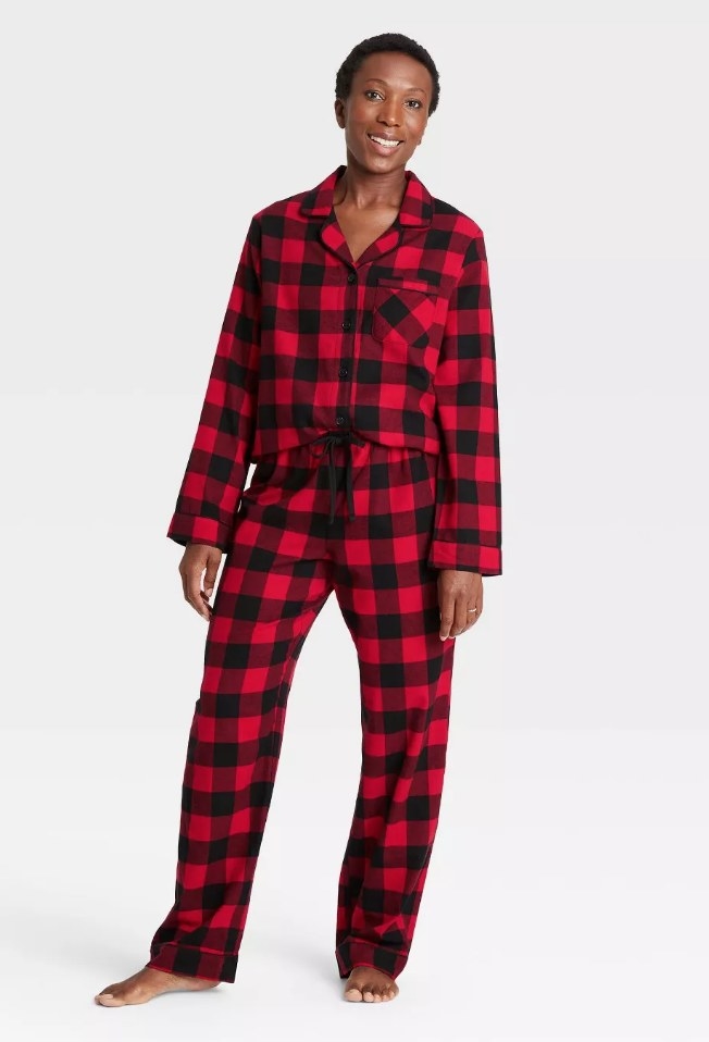 Model wearing black and red plaid long sleeve/long pant pajames