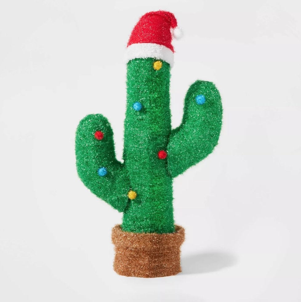 Tinsels cactus with ornaments and santa hat