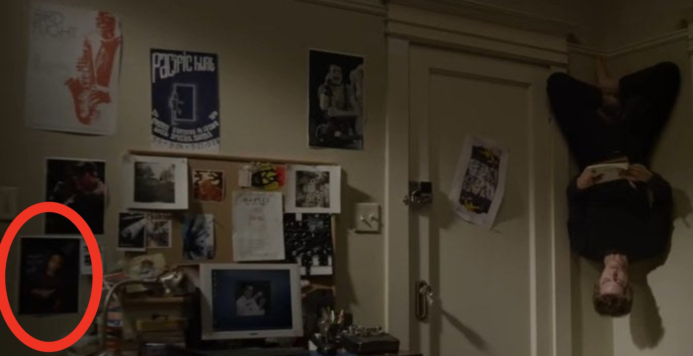 Peter hanging upside down from the wall in his room with a notebook in &quot;The Amazing Spider-Man&quot;