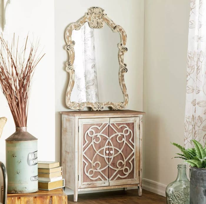 wooden cabinet with design and mirror